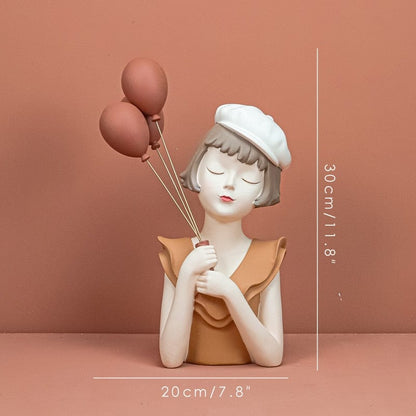 Figurine of a Girl with Balloons