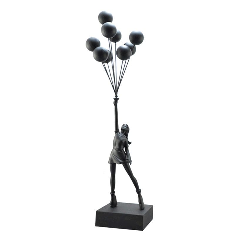 Escultura de la niña de Banksy volando con globos